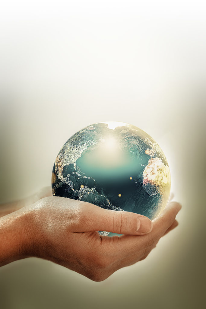 Hands holding earth - conceptual image of the earth day, saving energy, protecting the environment. Elements of this image furnished by NASA